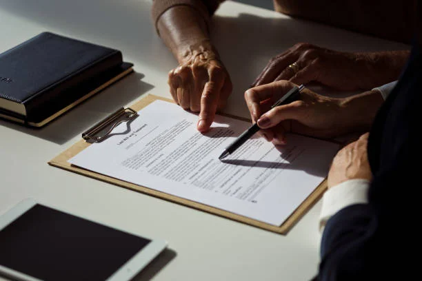 Female lawyer explaining the will to senior woman. 