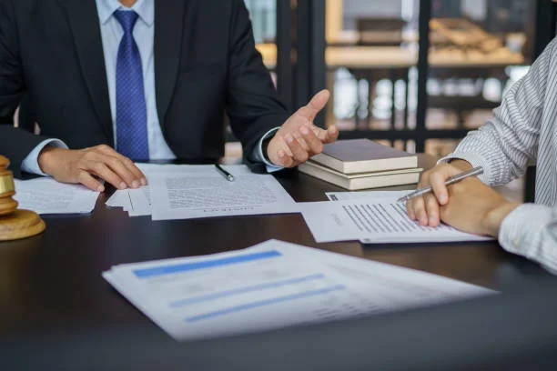 Lawyer Legal counsel presents to the client a signed contract 